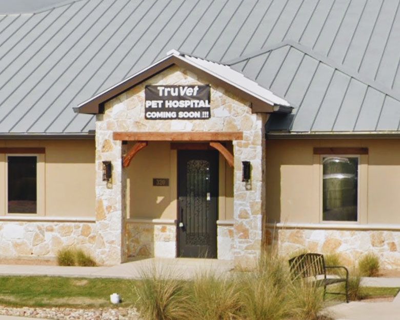 Veterinary hospital entrance with a sign reading "TruVet Pet Hospital Coming Soon!"